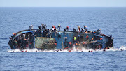 capsized migrant boat