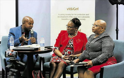 QUESTION TIME: Dispatch senior political reporter Zingisa Mvuvu hosting the MEC for Social Development Nancy Sihlwayi ( in red) and Head of Department Ntombi Baart during the department's post- Budget speech breakfast yesterday in East London. Picture: ALAN EASON