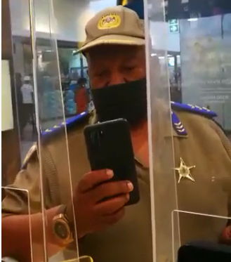 A Gauteng traffic cop is being probed after he was caught on camera seemingly insulting a cellphone store employee.
