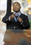 BOGUS PERFORMANCE: Thamsanqa Jantjie makes gestures during a speech at the memorial service for Nelson Mandela at the FNB Stadium this week