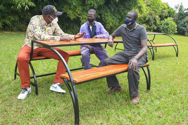 Deputy President William Ruto with the makers of the 'magic' seat at his Karen residence on July 9, 2020.