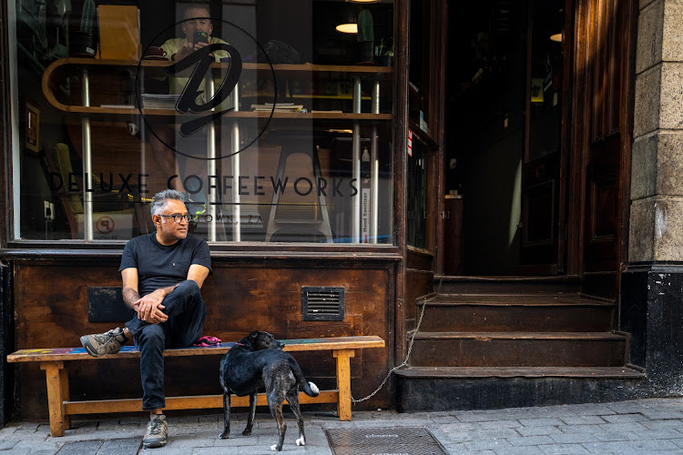Achmat and his dog, Nawal, in front of Deluxe Café in Church Street, Cape Town. Picture: Jay Caboz