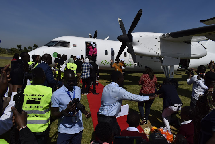 Road CS Kipchumba Murkomen and Homa Bay Governor Gladys Wanga alight from Renegade Airline at Kabunde airstrip in Homa Bay town on June 12,2023