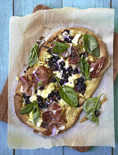 Blueberry & prosciutto pizzette The combination of sweet and salty toppings on these homemade mini pizzas really works.