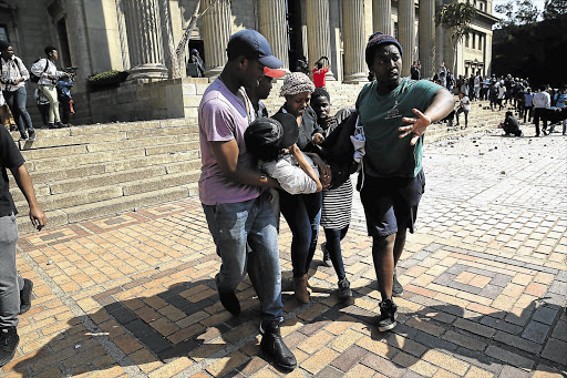 AFTERMATH: A student injured on the steps of the Wits Great Hall yesterday