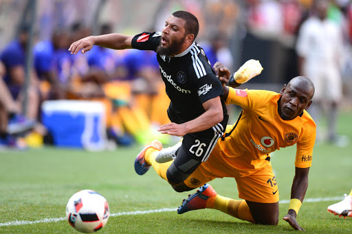 Riyaad Norodien of Orlando Pirates tackled by Sibusiso Khumalo of Kaizer Chiefs during the Absa Premiership match between Orlando Pirates and Kaizer Chiefs at FNB Stadium on October 29, 2016 in Johannesburg, South Africa. (Photo by