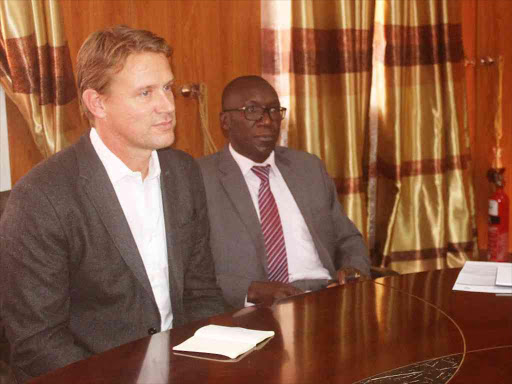 DFID Country Director Pete Vowles, CEC for Public Works Bernard Yaite and Busia Governor Sospeter Ojaamong in his office on Thursday.