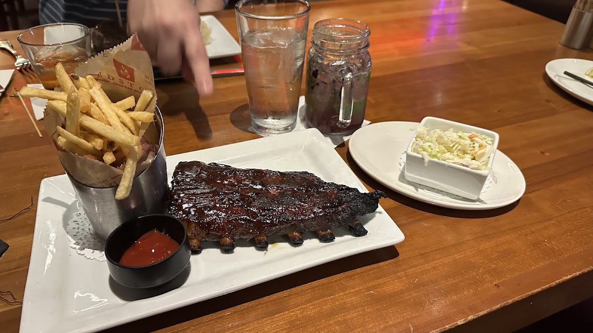 Half rack of bbq baby back ribs with french fries