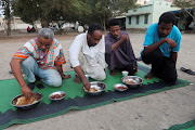 Displaced Sudanese break their fast at a displacement camp during the month of Ramadan, in the city of Port Sudan, Sudan, on March 14 2024. File photo.