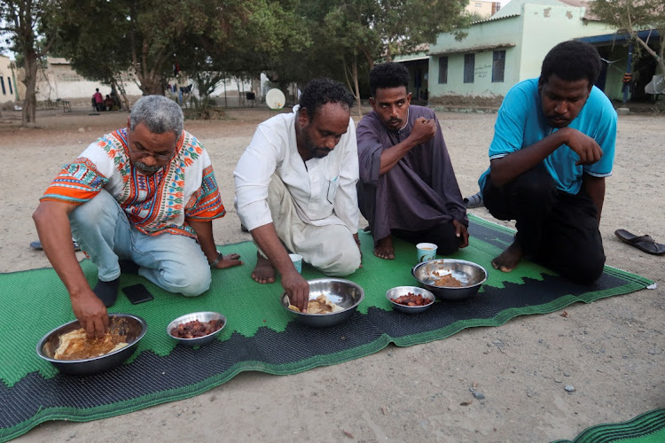 Displaced Sudanese break their fast at a displacement camp during the month of Ramadan, in the city of Port Sudan, Sudan, on March 14 2024. File photo.