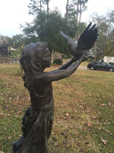 Girl with Bird Statue