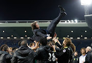 Chelsea manager Antonio Conte is thrown in the air by his players as they celebrate winning the Premier League title.
