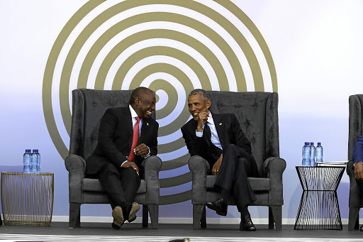 President Cyril Ramaphosa and former US president Barack Obama share a moment at the 16th Nelson Mandela Annual Lecture at the Wanderers Stadium in Johannesburg.