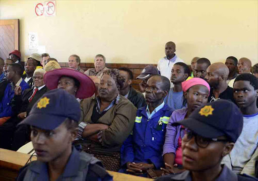 Two white farm workers accused of the murder of a black teenager in Coligny have been granted R5 000 bail.