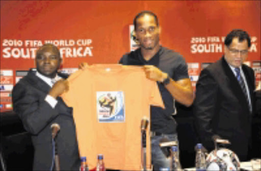 JOHANNESBURG, SOUTH AFRICA - OCTOBER 11, Coach Safa president Kirsten Nematandani,captain Didier Drogba and 2010 LOC CEO Danny Jordaan,Ivory Coast are the second African team to qualifer for 2010 world Cup during the Ivory Coast Press Conference from the Inter Continental Hotel on 11 October 2009 in Johannesburg, South Africa. Ivory Coast is the second African team to qualify for the 2010 World Cup Photo by Lefty Shivambu / Gallo Images