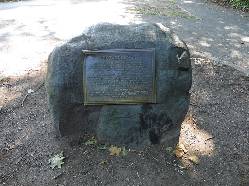 It's a plaque on a rock in Inwood Hill Park in the most Northern tip of Manhattan. The text on the plaque reads: "ACCORDING TO LEGEND, ON THIS SITE OF THE PRINCIPAL MANHATTAN INDIAN VILLAGE, PETER...