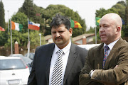 Billionaire businessman Atul Kumar Gupta with his Attorney Cliff Alexander, after his obstruction of Justice  case was dropped at the Radburg Magistrate Court in Johannesburg in 2010.