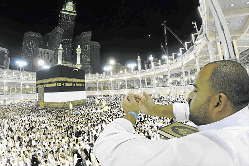 JOURNEY'S END: A Muslim pilgrim prays around the holy Kaaba at the Grand Mosque during the annual hajj pilgrimage in Mecca. The author of a new book claims that the true spirit of the pilgrimage is being trampled on by Saudi rulers who don't seem to understand the Prophet's message Picture: REUTERS