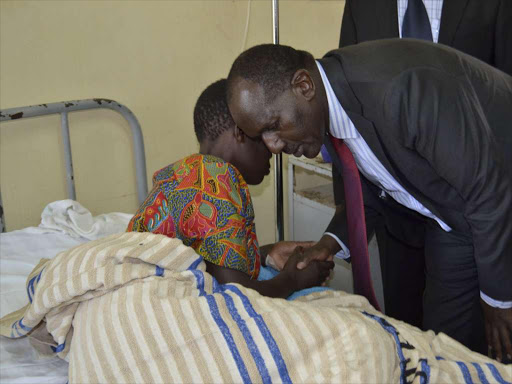 GET WELL: Nandi Governor Cleophas Lagat consoles a patient at the Kapsabet Referral Hospital on Monday