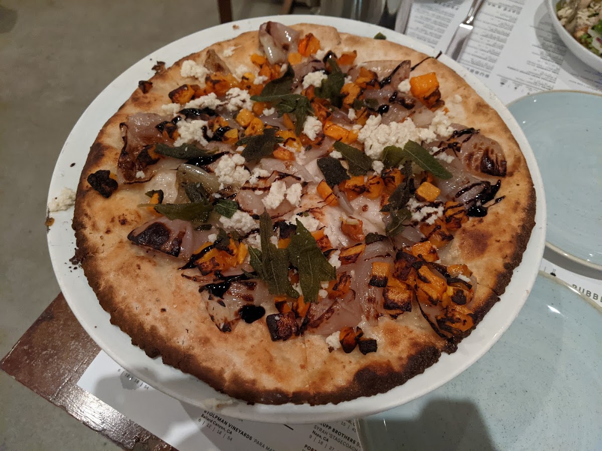 GF + Vegan butternut squash pizza (roasted squash, almond ricotta, confit shallot, sage, balsamic glaze, cauliflower crust)