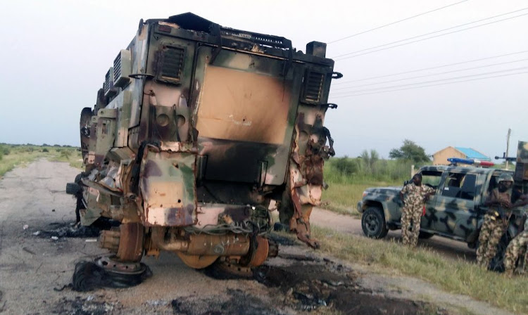 A damaged military vehicle is pictured in the northeast town of Gudumbali, after an attack by members of Islamic State in West Africa (ISWA), in Nigeria September 11 2018.