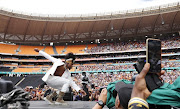 Usher turned things all the way up at FNB Stadium. 