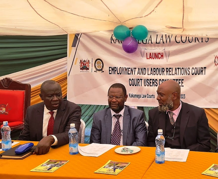 Kakamega county commissioner John Ondego and Judges P.J. Otieno and Stephen Radido during the launching of the Kakamega ELRC court user's committee at Golf Hotel on Wednesday