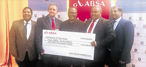 TUITION ASSISTANCE: At the handing over of a R4.65-million cheque from the Absa CEO Scholarship Fund that will benefit 60 students were UFH’s Professor Gilingwe Mayende, Absa citizenship manager Andy de la Mare, UFH vice-chancellor Sakhele Buhlungu, Absa’s public sector head Thembi Klaas and UFH’s Nielsh Ravgee Picture: SUPPLIED