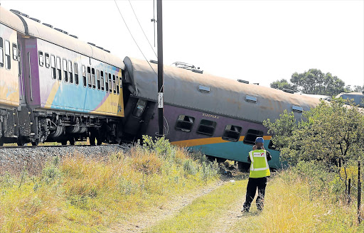 LONG HAUL: The day after a goods train and passenger train collided near Berlin yesterday, a crew of about 100 were hard at work trying to clear the site Picture: ALAN EASON