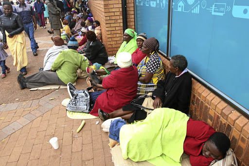 VBS Mutual Bank's customers queue outside the branch in Thohoyandou, Limpopo, hoping to withdraw some of their money for stokvels and burial societies.
