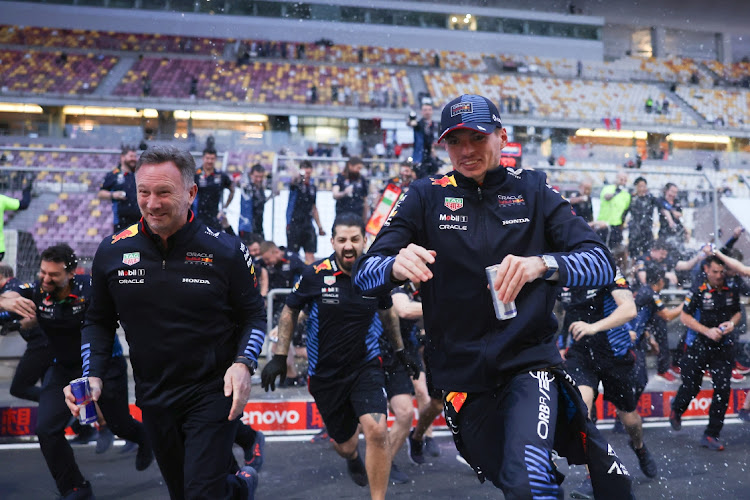 Race winner Max Verstappen of the Netherlands and Oracle Red Bull Racing and Oracle Red Bull Racing Team Principal Christian Horner celebrate with their team after the F1 Grand Prix of China at Shanghai International Circuit on April 21, 2024