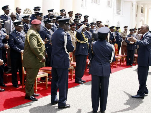President Uhuru Kenyatta with senior security officers following a consultative meeting at State House, Nairobi, after he assumed power in 2013. Photo/FILE