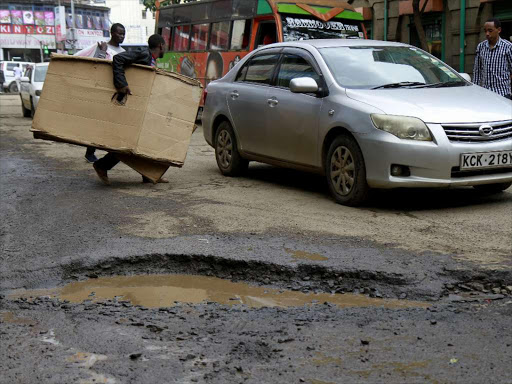 A pothole on a street in Nairobi CBD on May 11,2018. /ENOS TECHE