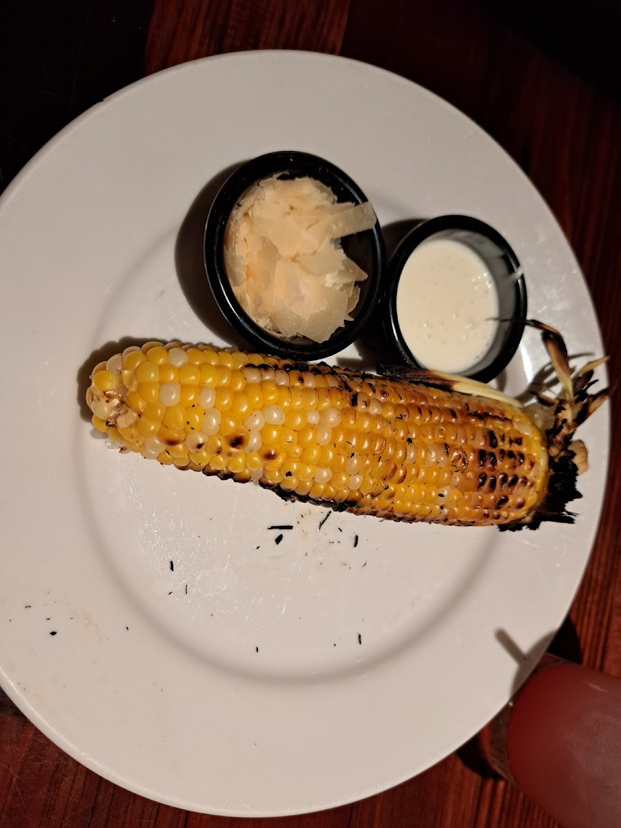 Roasted corn with crema and cheese on the side
