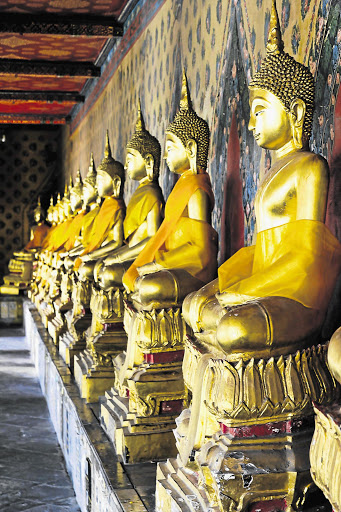 GOLDEN: Buddha statues at Wat Arun in Bangkok, the world's top destination