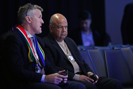 Stephen van Coller, CEO of corporate and investment banking at Barclays Africa Group, left, and finance minister Pravin Gordhan at the WEF in Davos