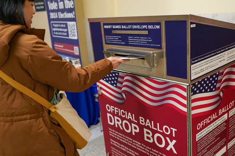 A voter casts their ballot during early voting, a day ahead of the Super Tuesday primary election, at the San Francisco City Hall voting center in San Francisco, California, US March 4, 2024.