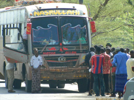 Passengers aboard a bus belonging Makah express company being checked at the Garissa-Tana bridge police barrier on 15th of November 2015. Two people was killed and three others injured when a bus belonging to the same company was attacked by gunmen at Dabasity near Elwak town on December 21, 2015. Photo/STEPHEN ASTARIKO