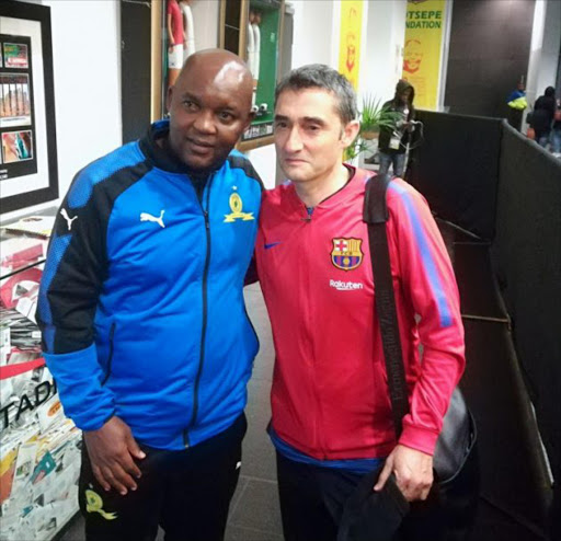 Mamelodi Sundowns head Pitso Mosimane with his FC Barcelona counterpart after the Nelson Mandela Centenary Cup between the two sides at FNB Stadium in Johannesburg Picture: Mahlatse Mphahlele