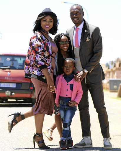 Reneilwe Letsholonyane with his wife Mpho Maboi and their daughter Keneilwe and son Thato.