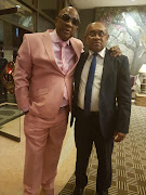 New Confederation of African Football (CAF) Ahmad (R) posing for a picture with Cosafa president Phillip Chiyangwa in Harare, Zimbabwe, on 24 February 2017.
