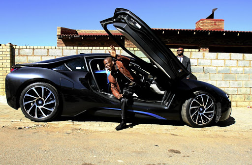 Pastor Mboro gets out of his luxury car in Orlando East, Soweto.