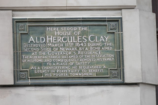 HERE STOOD THE HOUSE OF ALD. HERCULES CLAY, DESTROYED MARCH 11TH 1643 DURING THE SECOND SIEGE OF NEWARK BY A BOMB AIMED AT THE GOVERNOR'S RESIDENCE. THE ALDERMAN THRICE DREAMED OF THE DESTRUCTION...