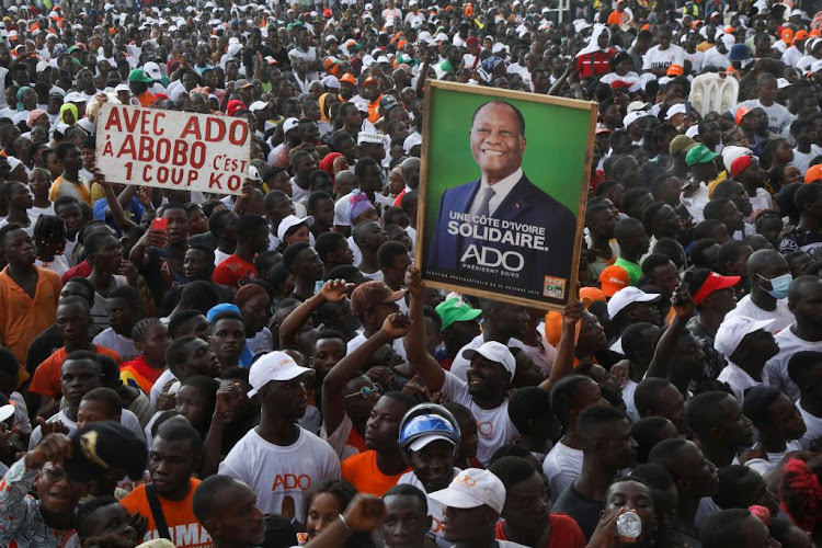 Supporters of the ruling RHDP coalition party attend Alassane Ouattara's last campaign rally on October 29 2020 for the presidential election, in Abidjan, Ivory Coast.