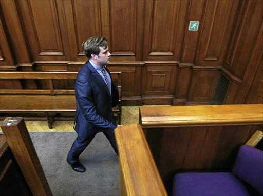 Murder accused Henri van Breda walks out of the High Court in Cape Town.