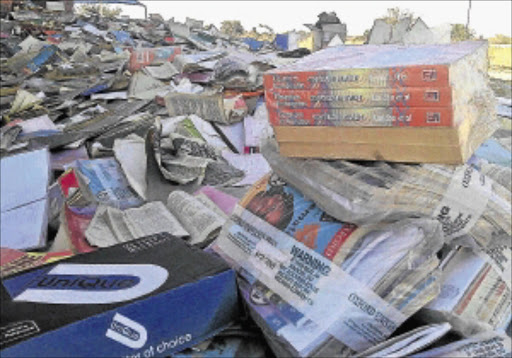 DUMPED KNOWLEDGE: Textbooks found at a dump site in Seshego, near Polokwane, last week. Photo: Gallo Images