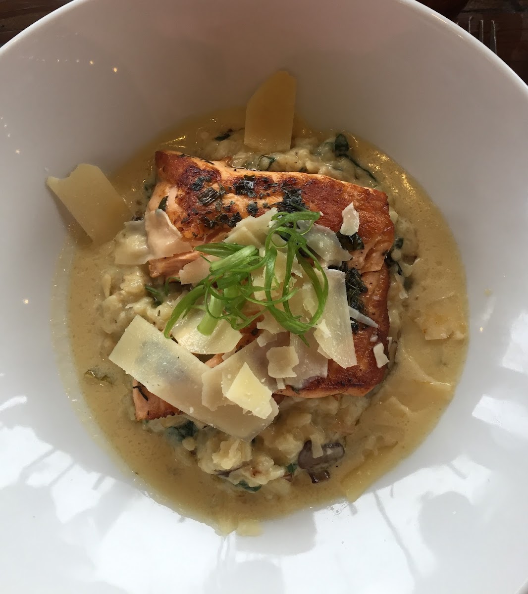 Scottish salmon over a mushroom and spinach risotto