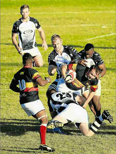 Buffs player Tjaart Venter is tackled during the club match against Old Boys at Mike Pendock Motors Park on Saturday afternoon Picture: SINO MAJANGAZA