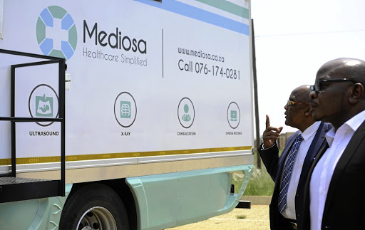 Health Minister Aaron Motsoaledi inspects a mobile clinic belonging to the Gupta-linked Mediosa.