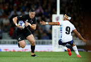 New Zealand's Cam Roigard in action with Namibia's Damian Stevens in their 2023 Rugby World Cup Pool A match at Stadium Municipal de Toulouse in France  on September 15 2023.
